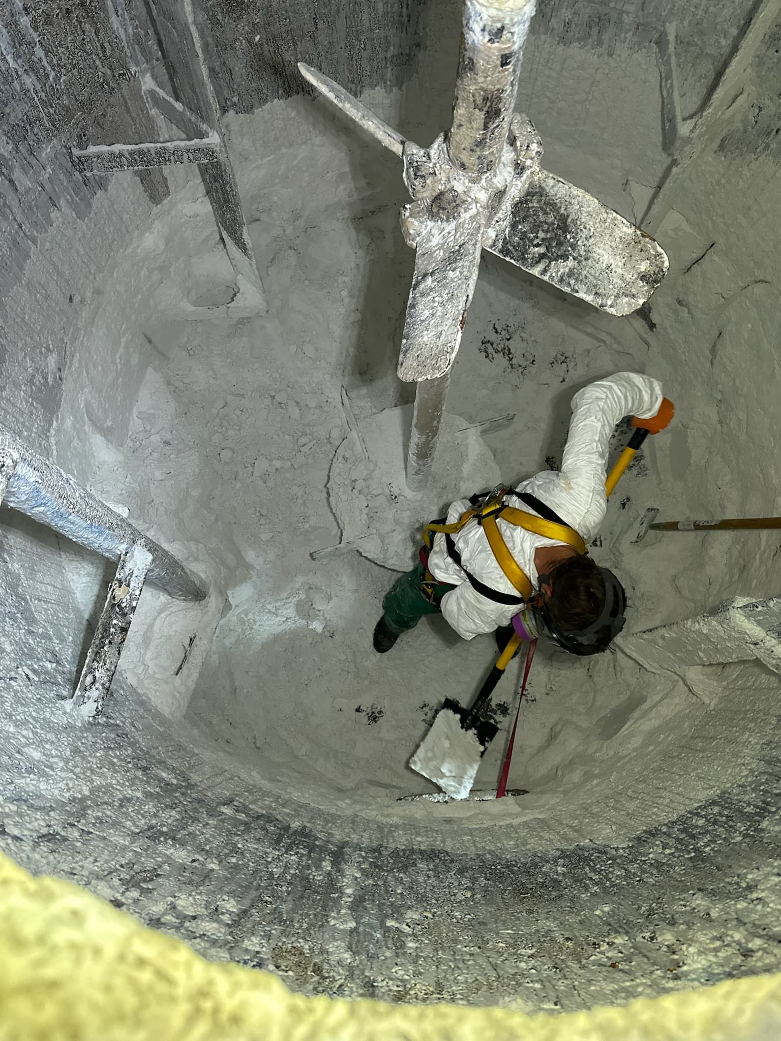 Environmental technician performing tank entry industrial cleaning